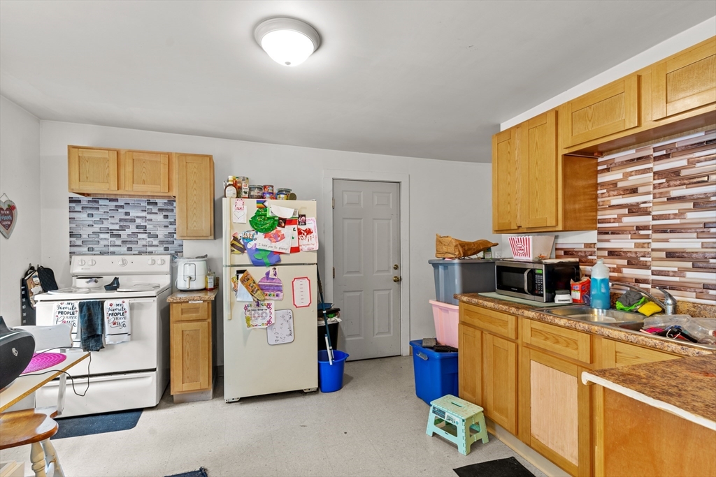 126 Earle Street Woonsocket, RI 02895 - Photo 17 of 42 a utility room with fridge dryer and washer