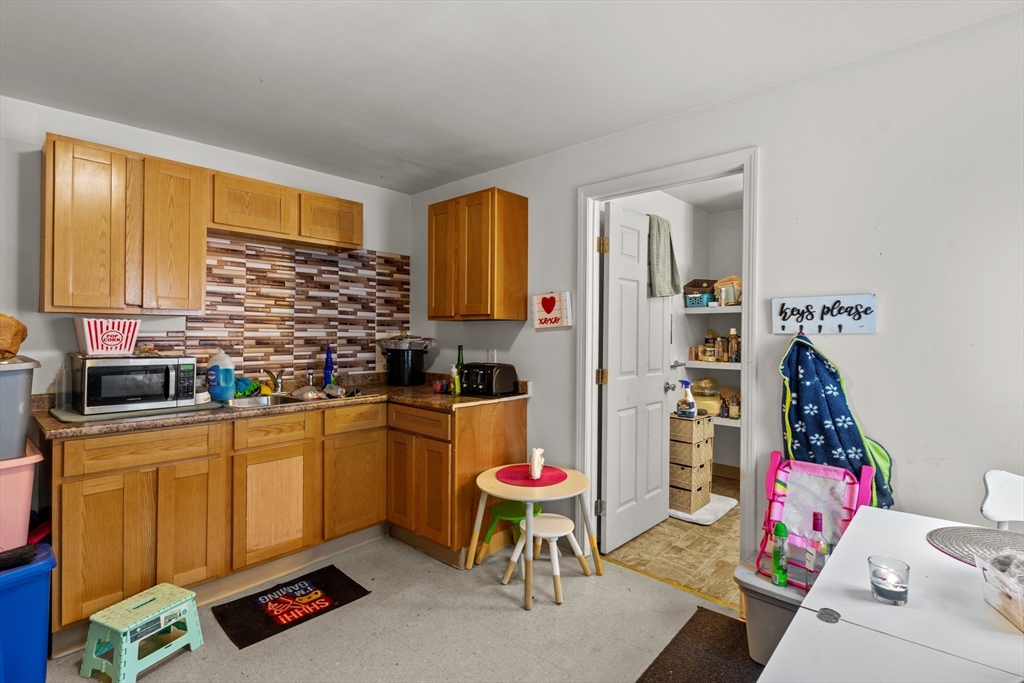 126 Earle Street Woonsocket, RI 02895 - Photo 18 of 42 a living room with furniture and flat screen tv