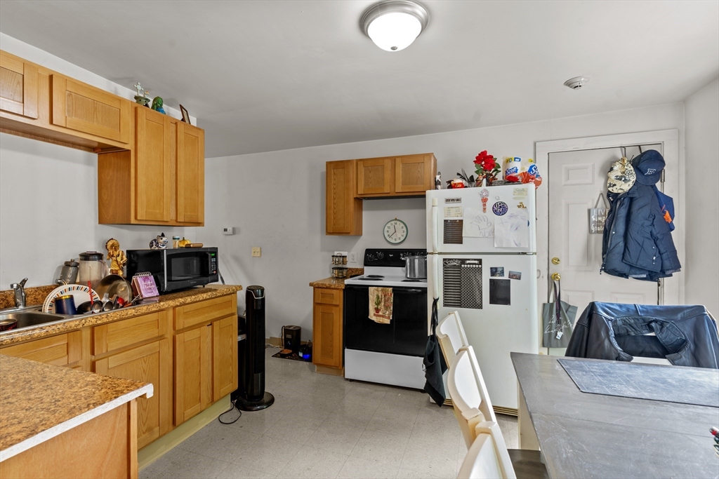 126 Earle Street Woonsocket, RI 02895 - Photo 19 of 42 a room with furniture a flat screen tv and a sink