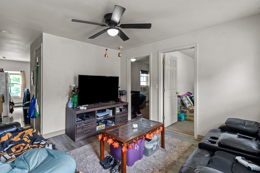 126 Earle Street Woonsocket, RI 02895 - Photo 24 of 42 a living room with furniture and a flat screen tv