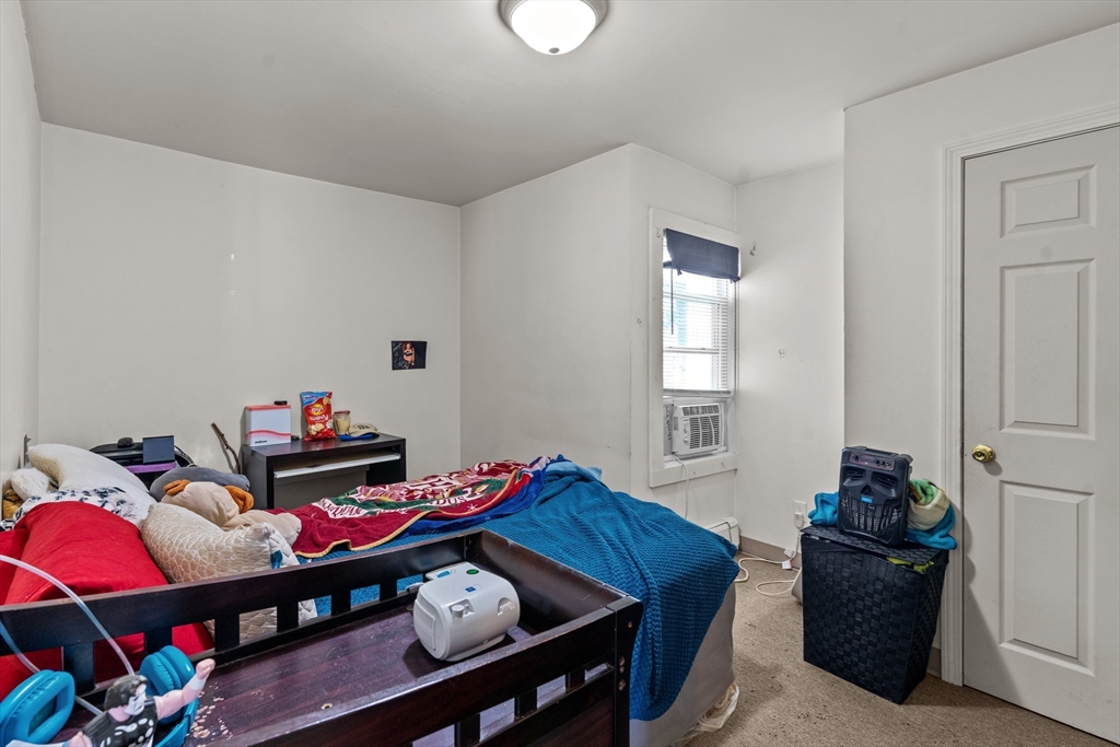 126 Earle Street Woonsocket, RI 02895 - Photo 26 of 42 a room with furniture and a wooden floor