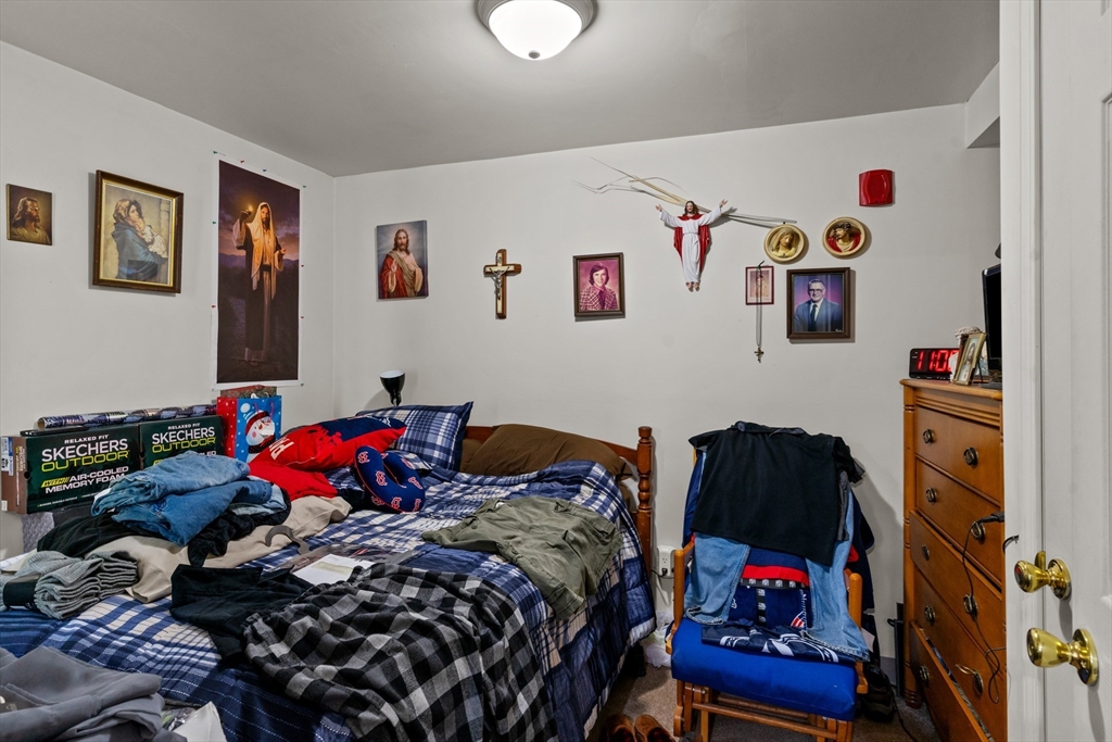 126 Earle Street Woonsocket, RI 02895 - Photo 36 of 42 a bedroom with a bed and cabinets