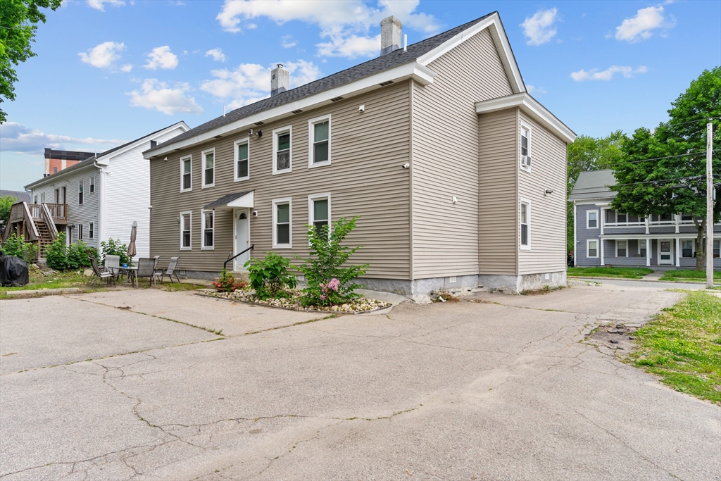 126 Earle Street Woonsocket, RI 02895 - Photo 4 of 42 a view of a house with a street