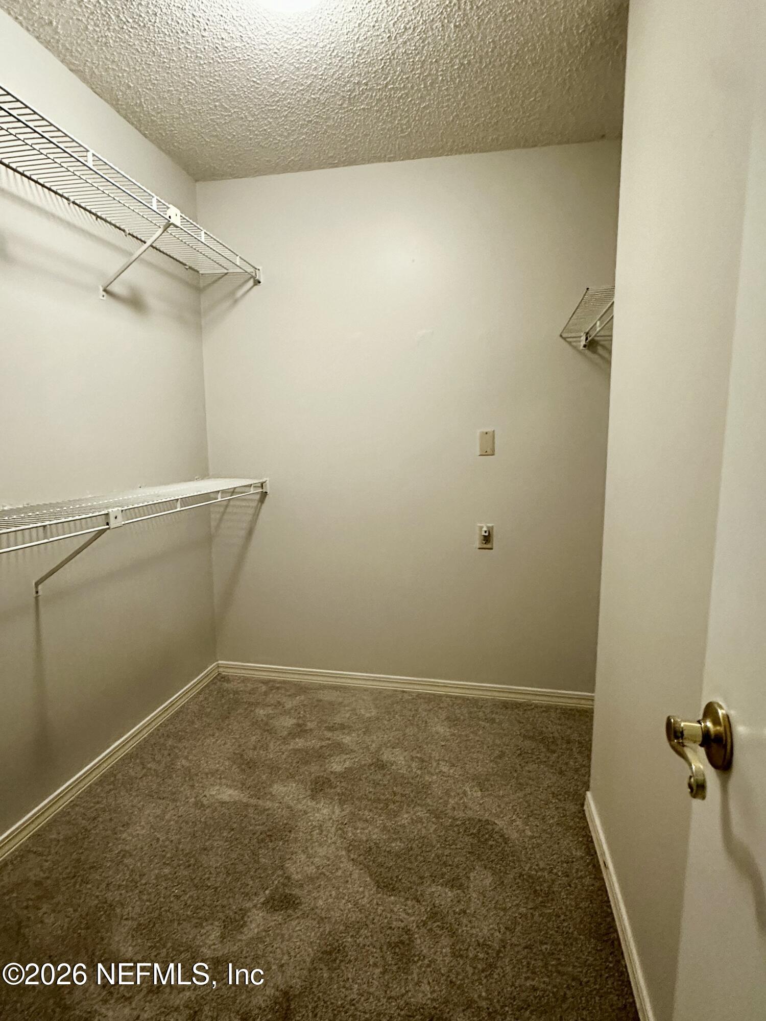 2245 Brentfield Road West Jacksonville, FL 32225 - Photo 14 of 21 a view of a room with racks on the wall