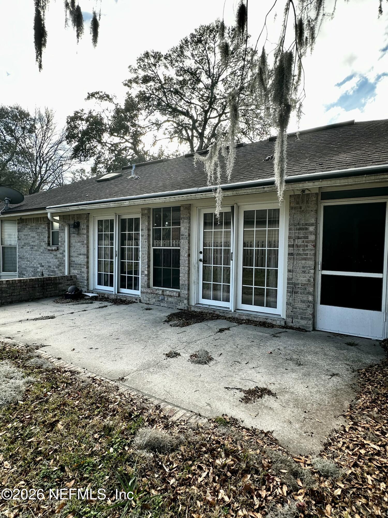 2245 Brentfield Road West Jacksonville, FL 32225 - Photo 20 of 21 a front view of a house with a large tree and yard