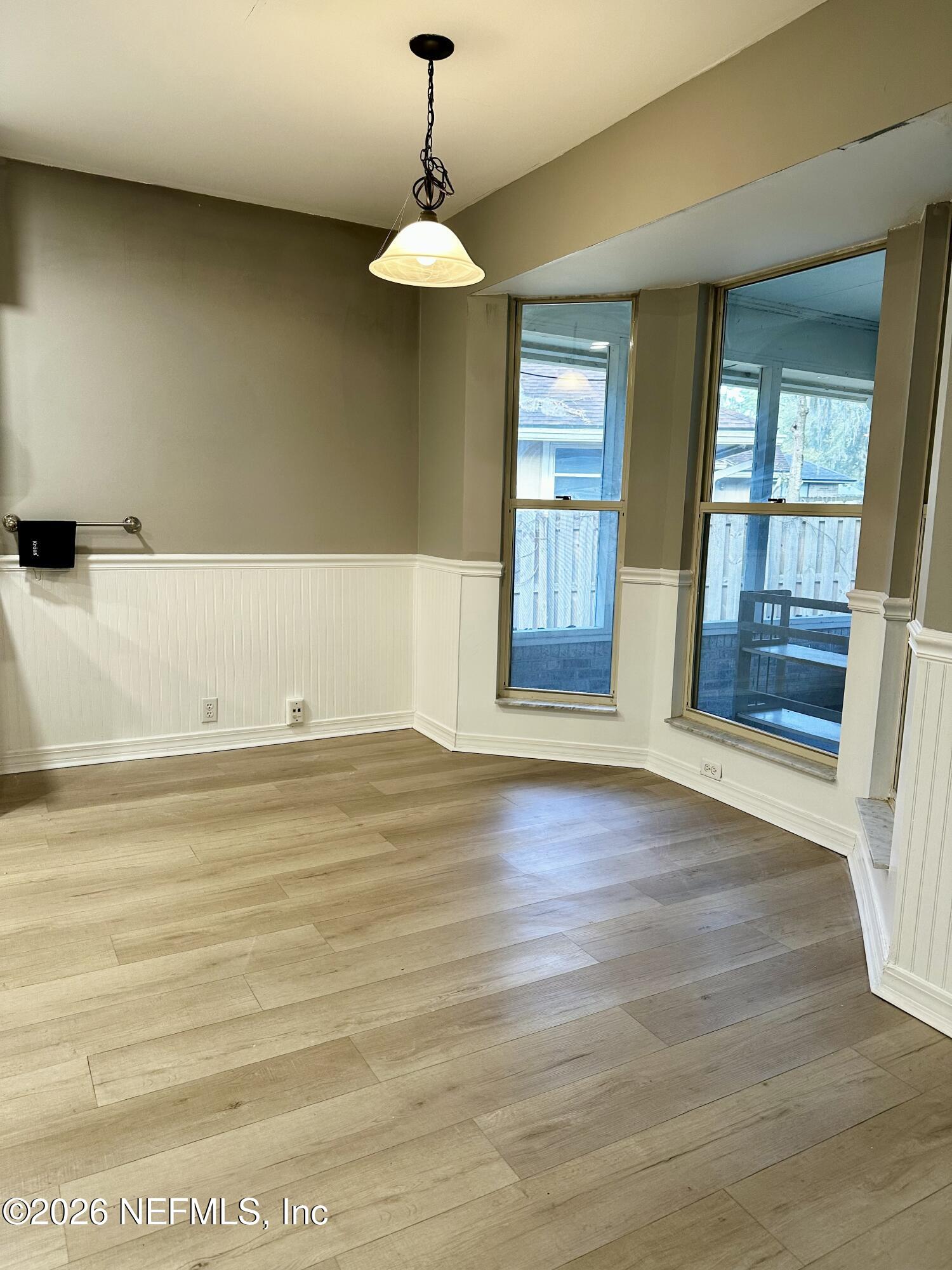 2245 Brentfield Road West Jacksonville, FL 32225 - Photo 6 of 21 a view of empty room with window and wooden floor