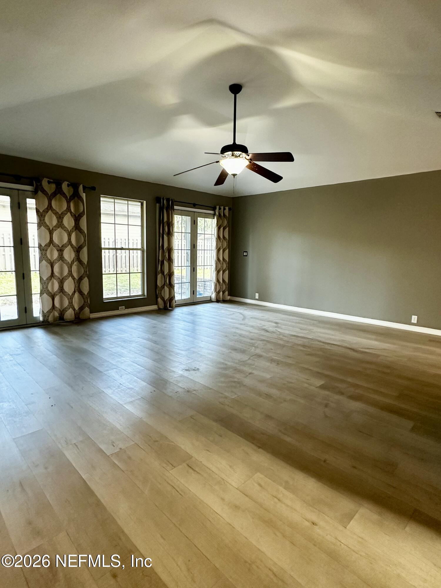 2245 Brentfield Road West Jacksonville, FL 32225 - Photo 9 of 21 a view of an empty room with window and chandelier
