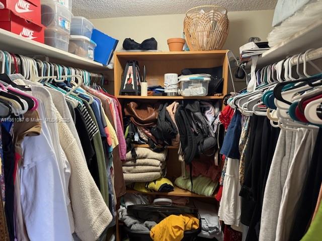Horizons West Miami, FL 33183 - Photo 9 of 18 a view of walk in closet with clothes and shoes