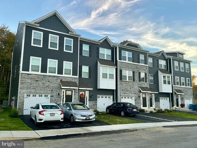 a car parked in front of a brick building