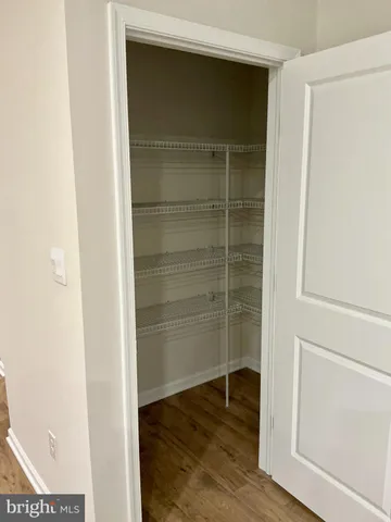 a bathroom with a toilet and a window