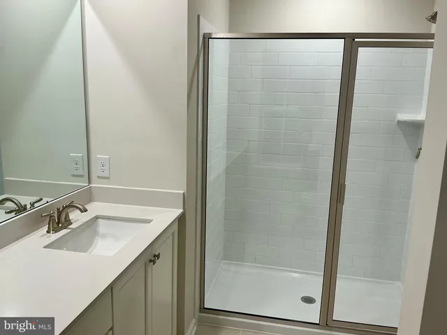 a bathroom with a shower and yard