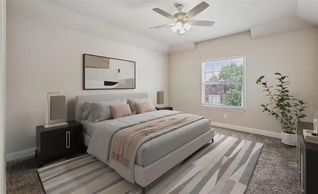 a bedroom with a large bed and a window