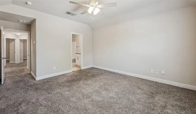 an empty room with a bathroom