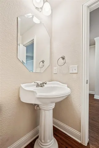 a bathroom with a sink and mirror