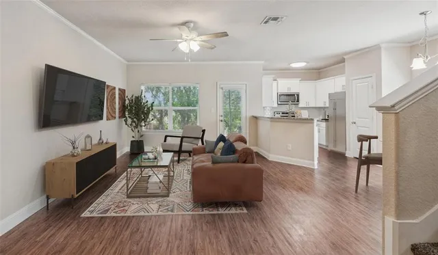 a living room with furniture and a flat screen tv