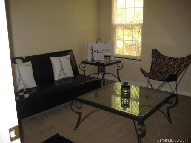 11024 Pointer Ridge Drive Charlotte, NC 28214 - Photo 7 of 8 a living room with chairs and a window