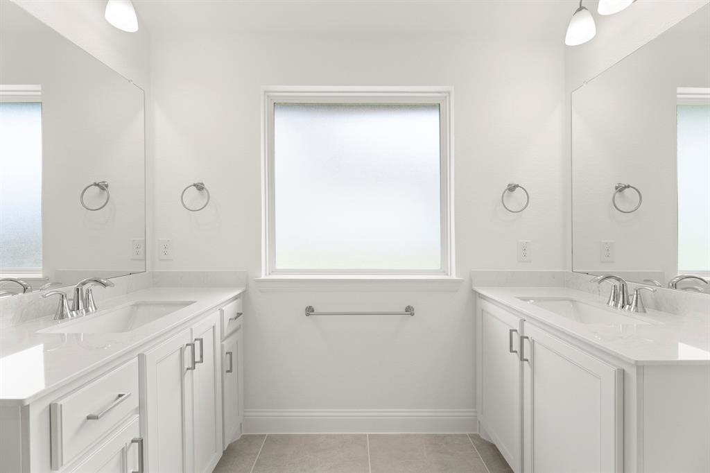 14551 Elion Court Pilot Point, TX 76258 - Photo 13 of 23 a bathroom with a sink a vanity and a mirror