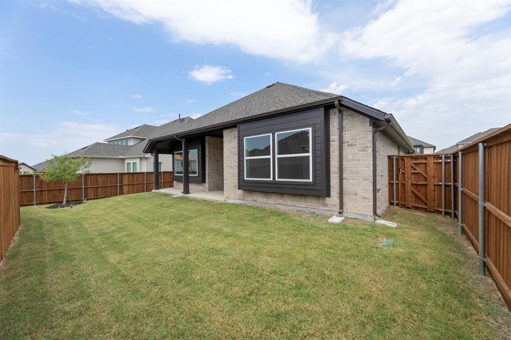 14551 Elion Court Pilot Point, TX 76258 - Photo 22 of 23 a house with yard in front of it