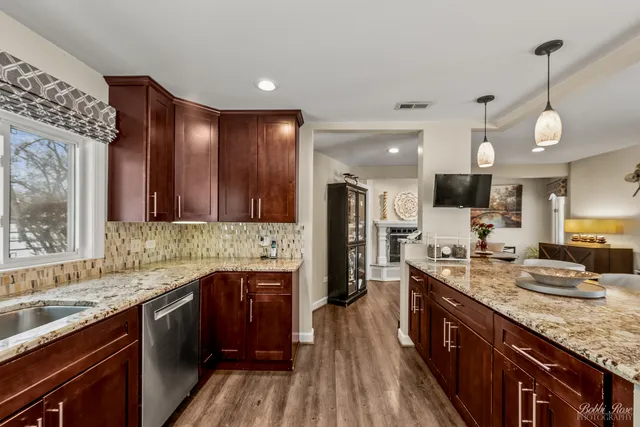 a kitchen with a sink and large window