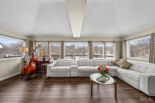 a room with furniture and a large window