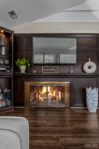 a bedroom with a bed and a television