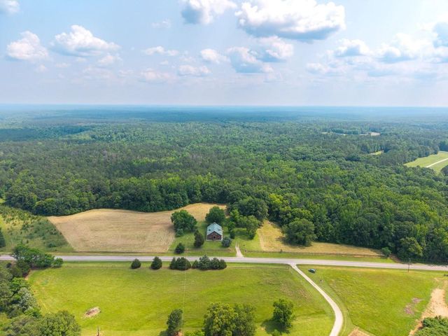 a view of a swimming pool with a yard