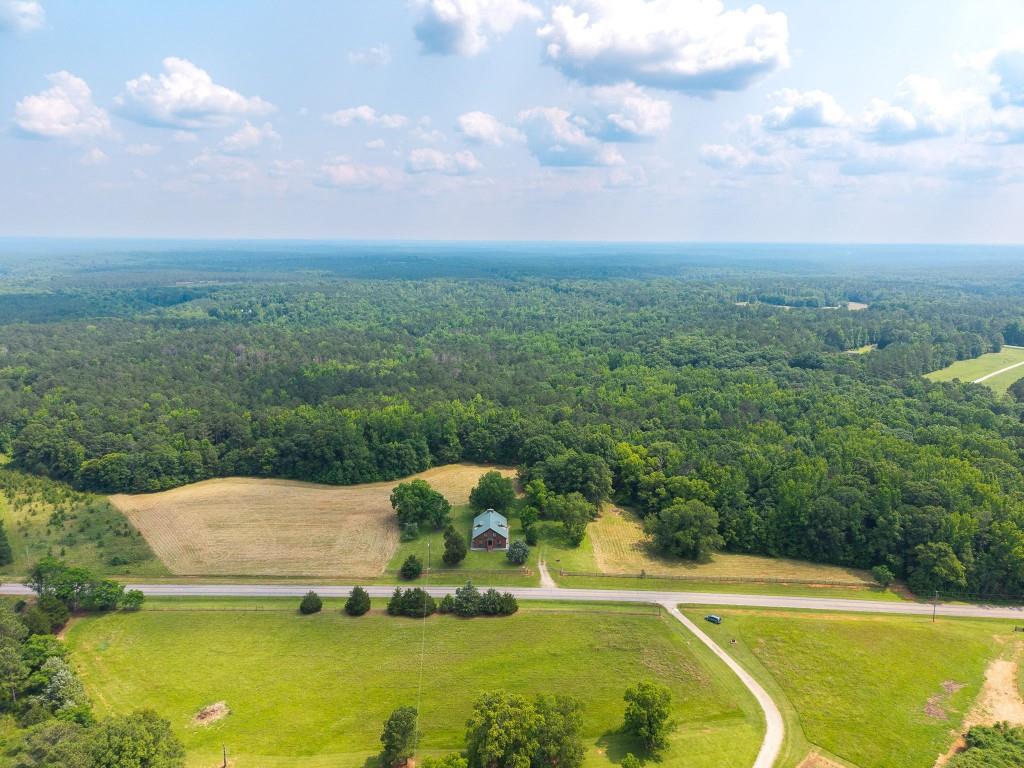 3780 Brownwood Road Madison, GA 30650 - Photo 1 of 25 a view of a swimming pool with a yard