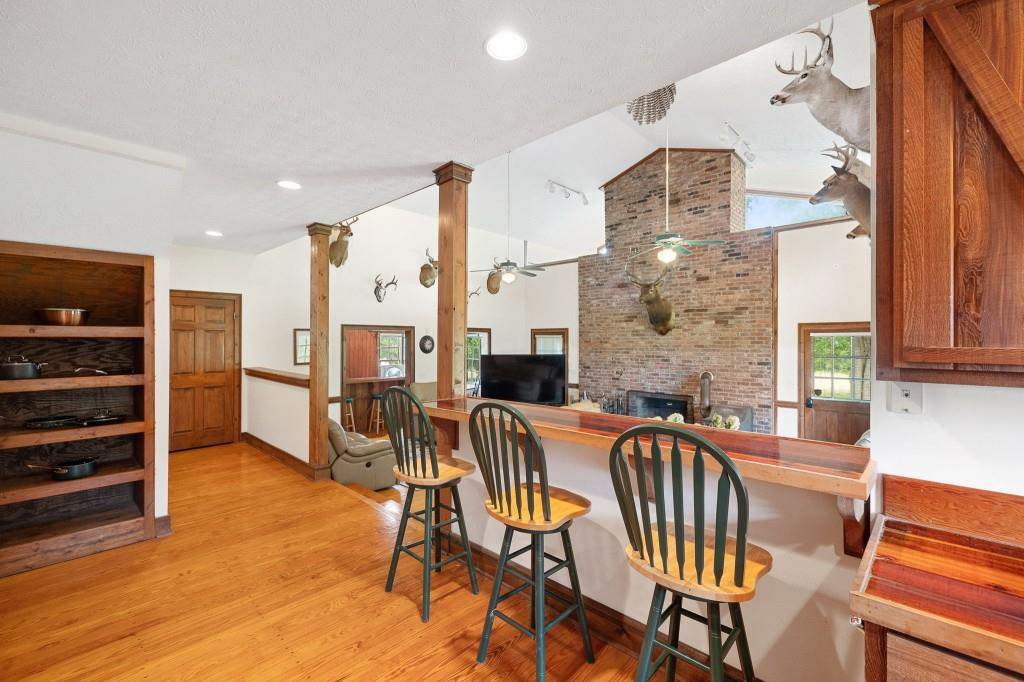 3780 Brownwood Road Madison, GA 30650 - Photo 11 of 25 a view of a dining room with furniture window and wooden floor