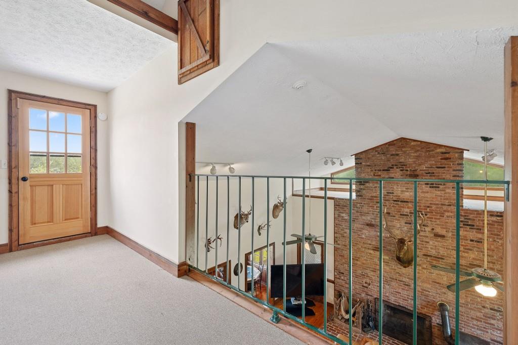 3780 Brownwood Road Madison, GA 30650 - Photo 18 of 25 a view of staircase with wooden floor and windows
