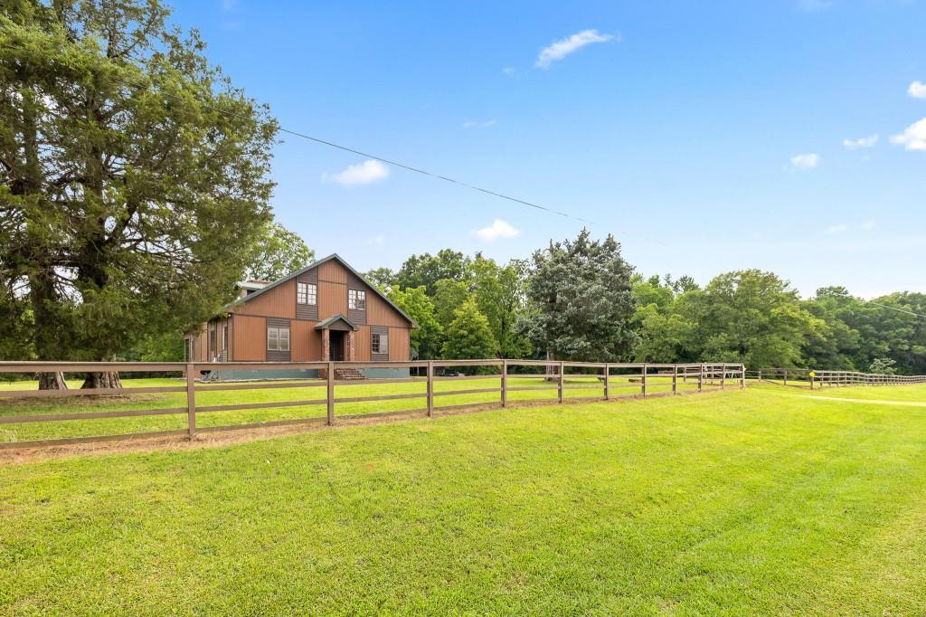 3780 Brownwood Road Madison, GA 30650 - Photo 4 of 25 a view of a swimming pool with an outdoor space and seating area