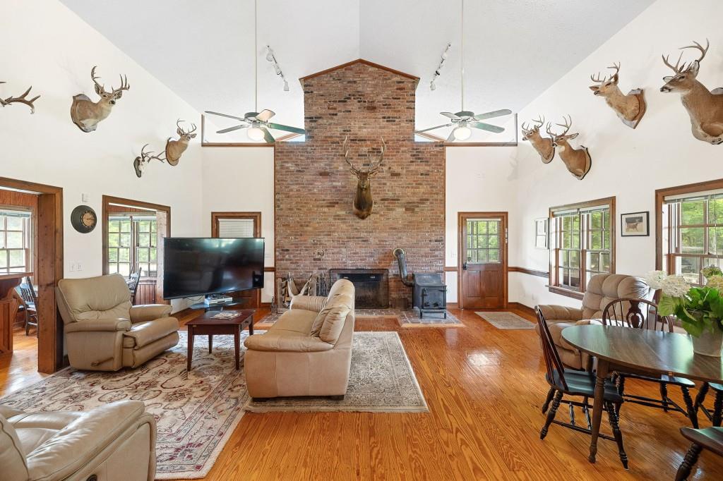3780 Brownwood Road Madison, GA 30650 - Photo 6 of 25 a living room with furniture wooden floor and a flat screen tv