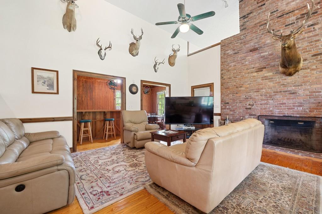 3780 Brownwood Road Madison, GA 30650 - Photo 7 of 25 a living room with furniture and a flat screen tv