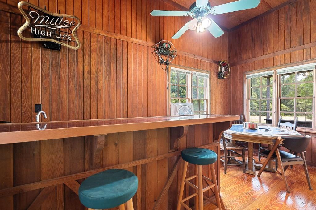 3780 Brownwood Road Madison, GA 30650 - Photo 8 of 25 a view of a dining room with furniture a chandelier and wooden floor