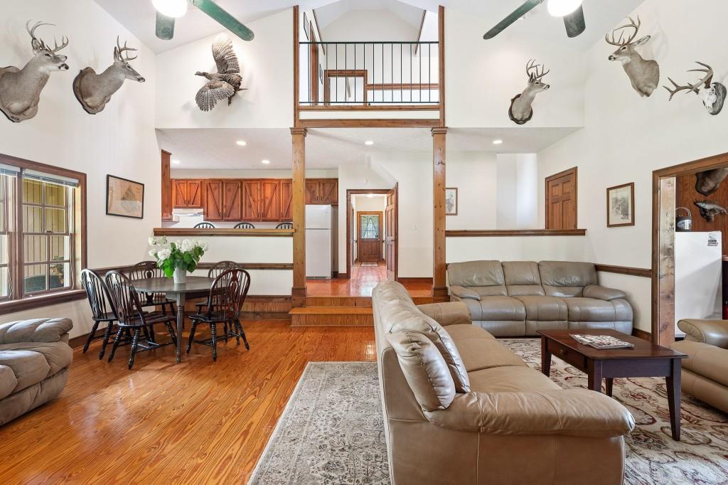 3780 Brownwood Road Madison, GA 30650 - Photo 9 of 25 a living room with fireplace furniture and a wooden floor