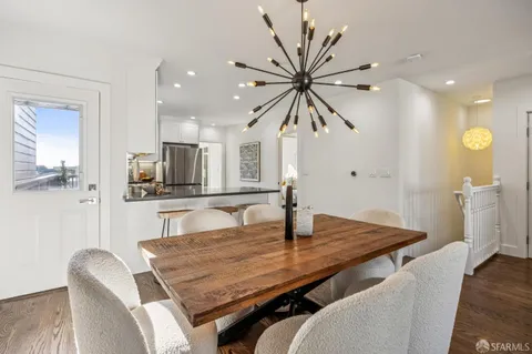 a kitchen with stainless steel appliances a stove a sink and a microwave