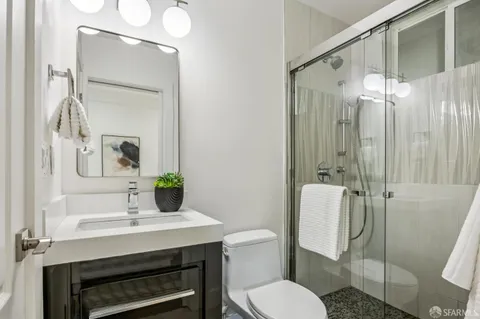 a view of a chairs and table in backyard