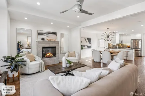 a dining room with kitchen island a table and chairs