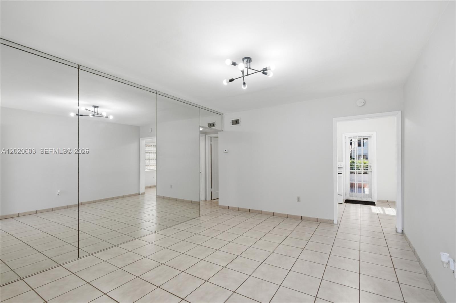 3750 Southwest 27th Street Miami, FL 33134 - Photo 4 of 41 an empty room with fan and glass door