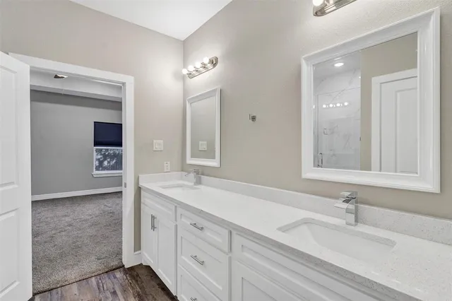 a bathroom with a sink and a mirror