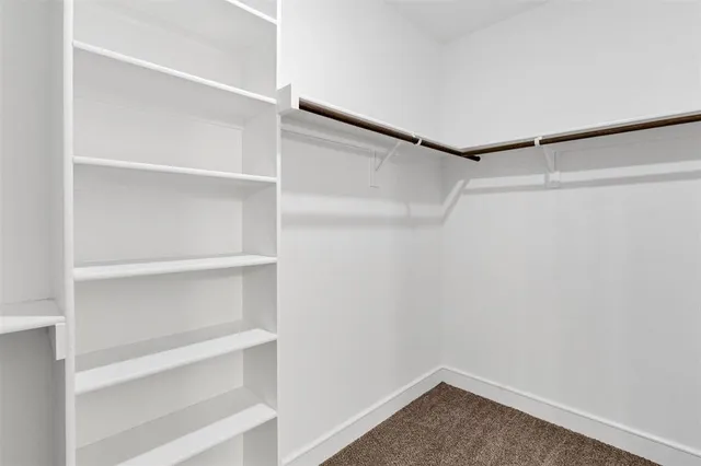 a view of an empty walk in closet