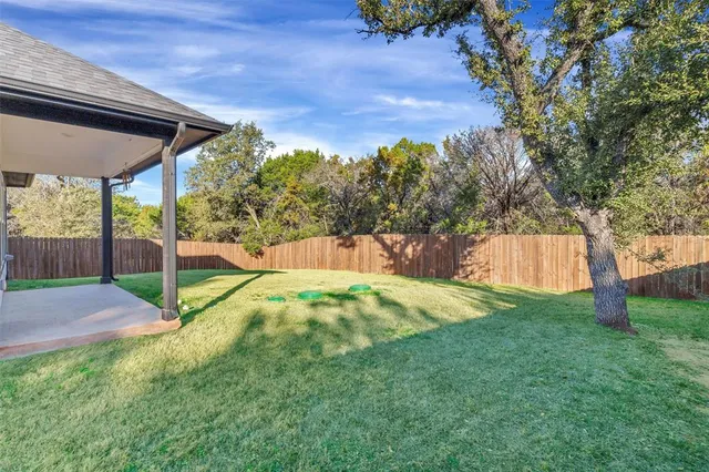 a view of backyard with green space