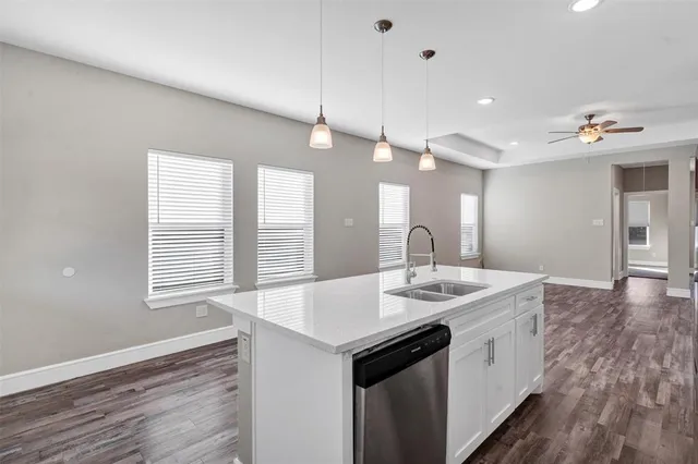 a kitchen with a sink and stove