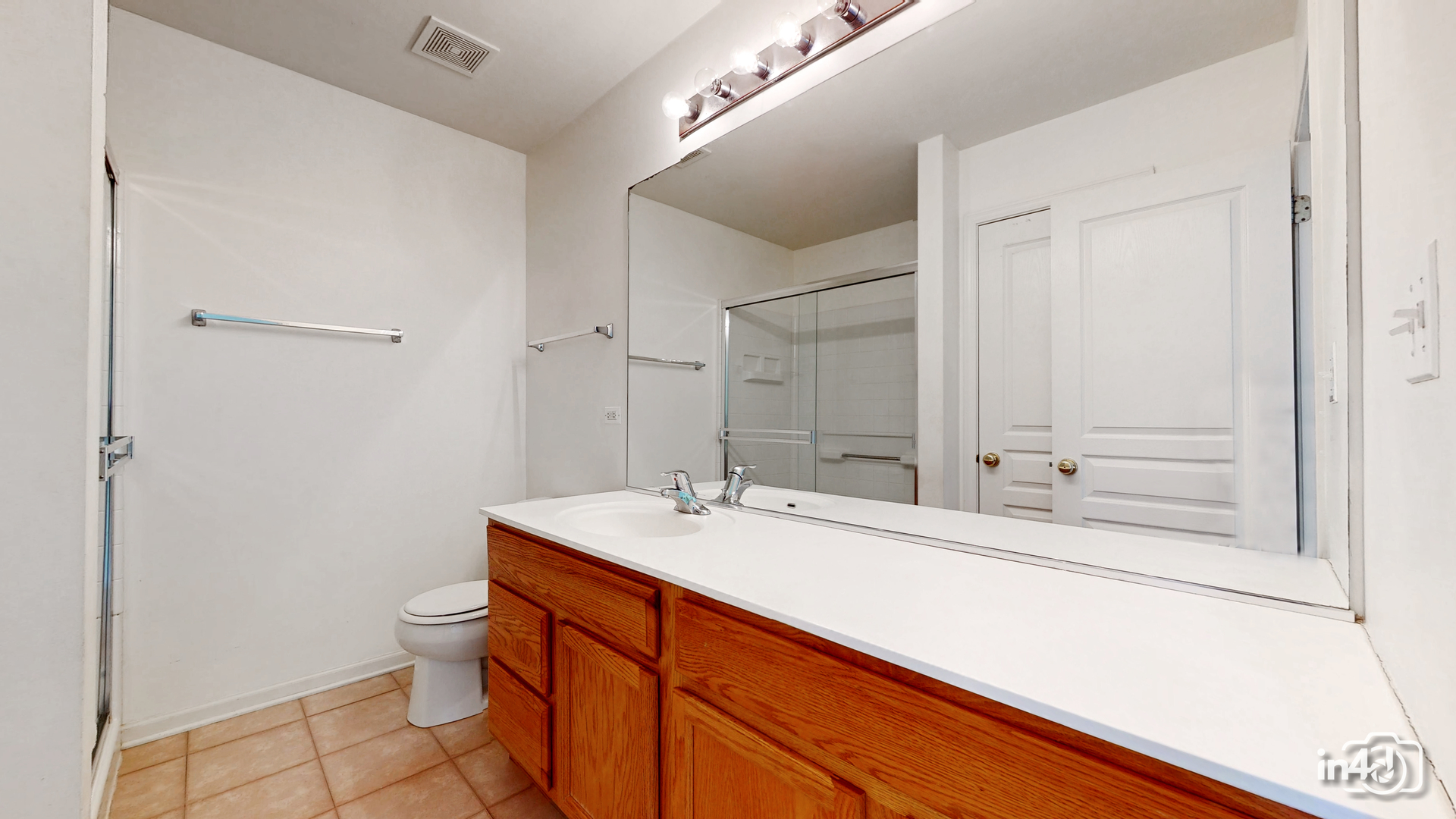 529 Metropolitan Street Aurora, IL 60502 - Photo 14 of 29 a bathroom with a sink a toilet and shower