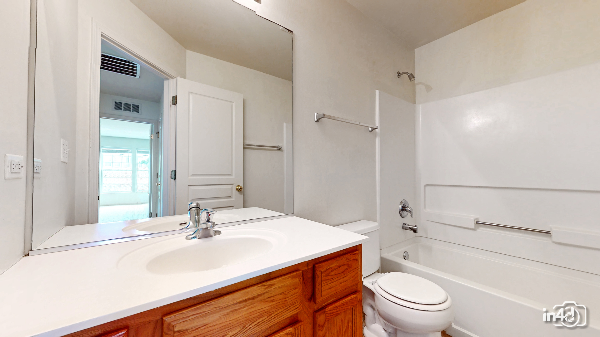 529 Metropolitan Street Aurora, IL 60502 - Photo 20 of 29 a bathroom with a sink toilet vanity and shower