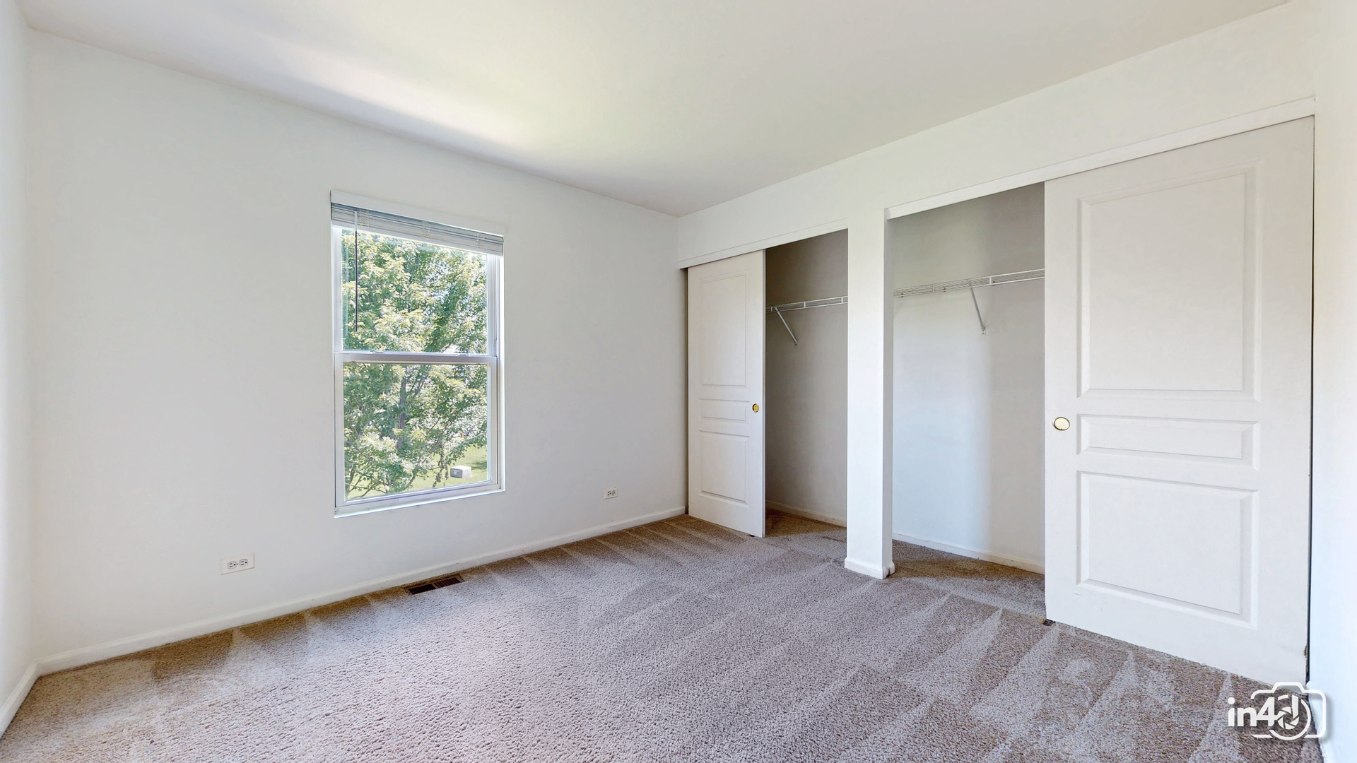 529 Metropolitan Street Aurora, IL 60502 - Photo 22 of 29 an empty room with windows and closet