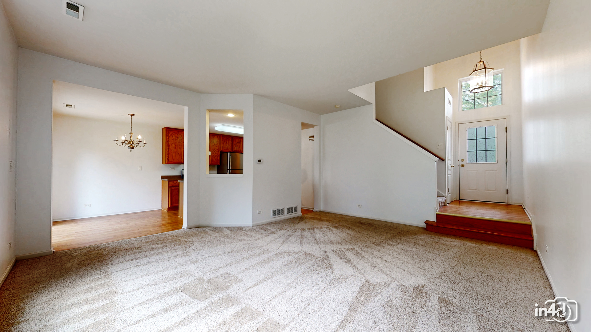 529 Metropolitan Street Aurora, IL 60502 - Photo 5 of 29 a view of empty room with stairs and white walls