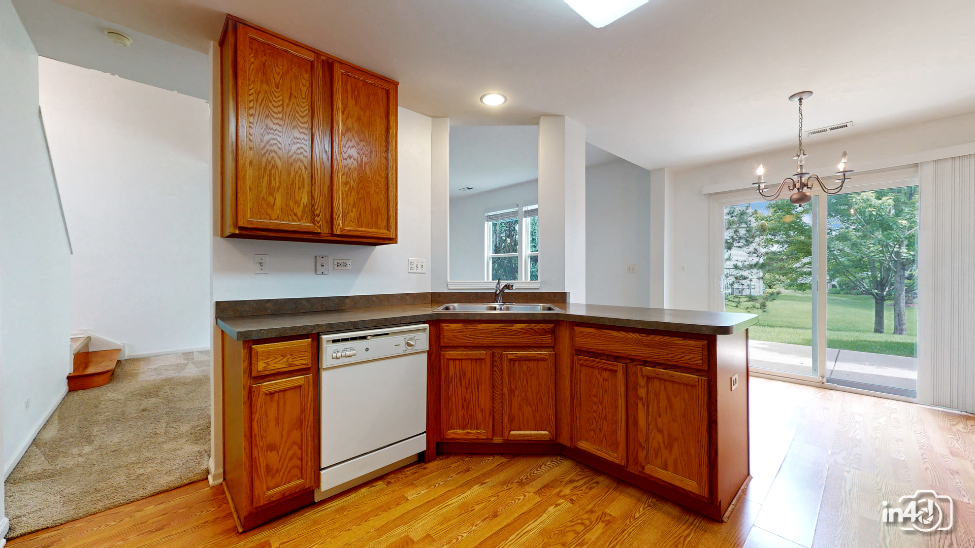 529 Metropolitan Street Aurora, IL 60502 - Photo 10 of 29 a kitchen with stainless steel appliances granite countertop wooden cabinets and a granite counter tops