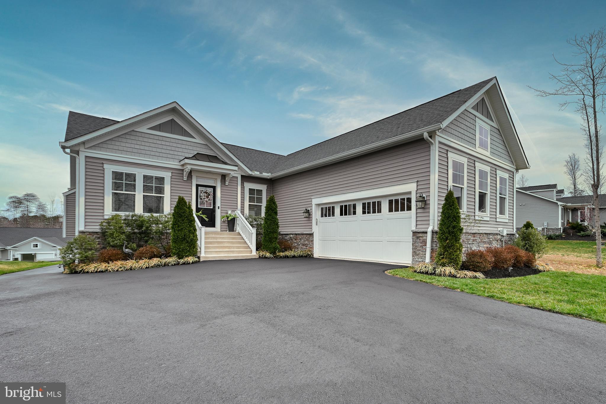 287 Sunset Loop Mineral, VA 23117 - Photo 8 of 112 a front view of a house with a yard and garage