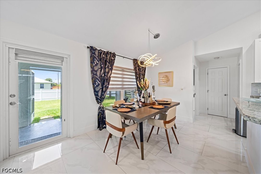 22 Nelson Road South Cape Coral, FL 33991 - Photo 13 of 43 a view of a workspace with furniture and window