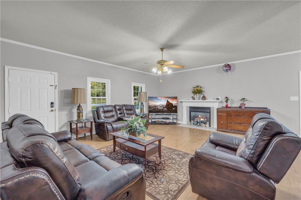 140 Breckenridge Lane Athens, GA 30606 - Photo 6 of 36 a living room with furniture and a chandelier